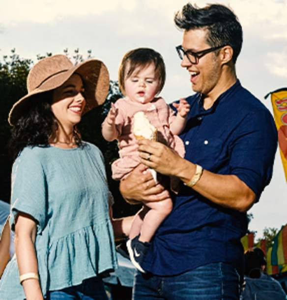 Young family with baby eating ice cream