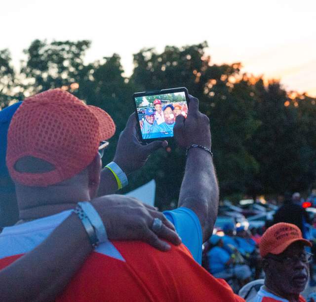 Group taking selfie in hotel lot