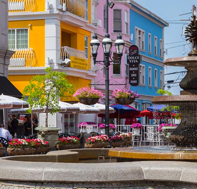 Patio seating surrounds the fountain at DePasquale Square in the Federal Hill neighborhood of Providence
