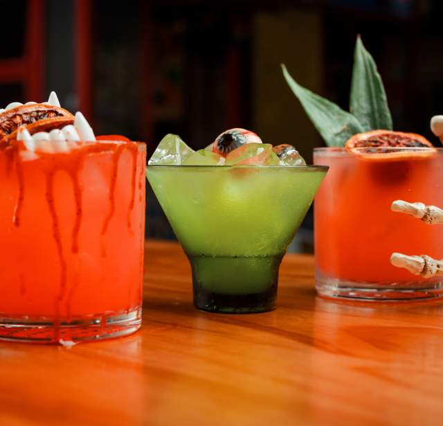 three Halloween themed cocktails