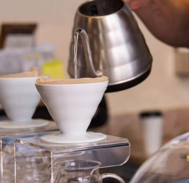 A cup of tea being poured.