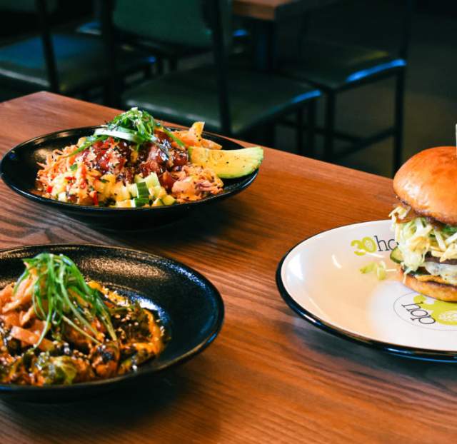 A table with three plates of food from 30hop.