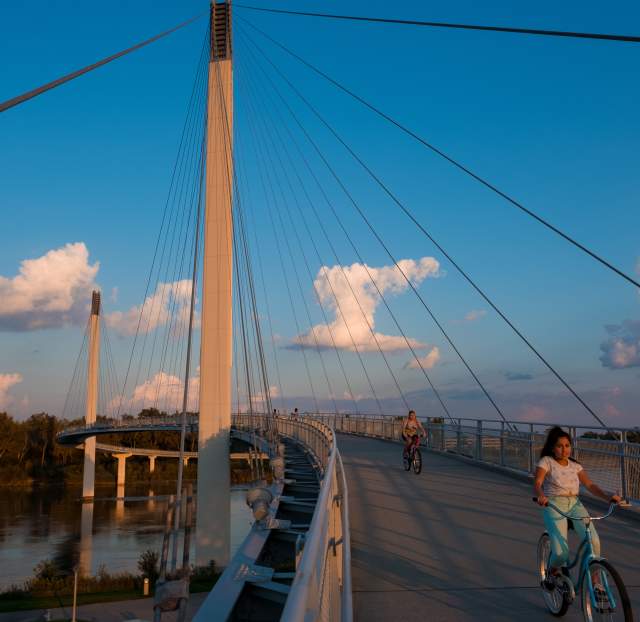 Person Riding Bike Across Bob the Bridge in Omaha