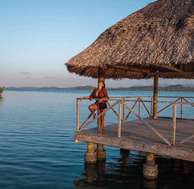 Woman relaxing at the beach of Playa Paraiso in Portobelo