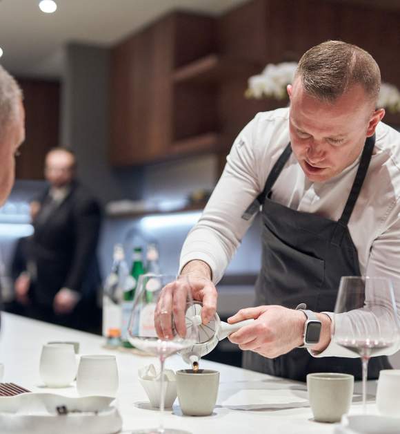 Chef Ryan Ratino serves a guest at the One-MICHELIN-Star ÔMO by Jônt in Winter Park, Florida.