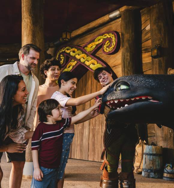 Multi-generational mixed Hispanic family at Epic Toothless meet and greet, How to Train Your Dragon