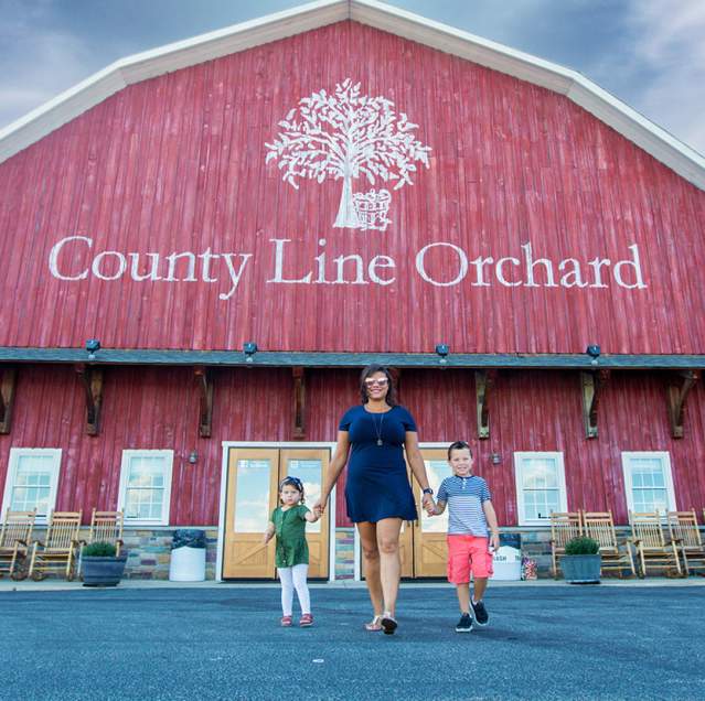 Family outside County Line Orchard