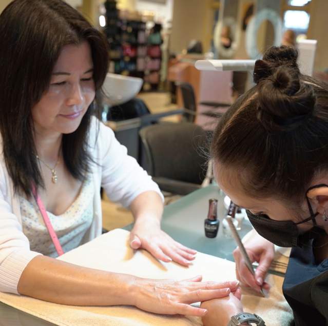 Woman getting manicure at State of Mind Spa