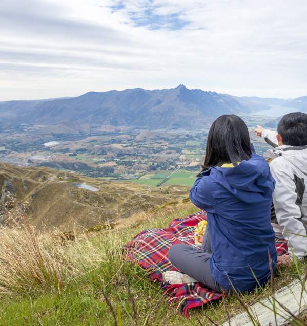 Sightseeing from Coronet Peak in summer with a picnic