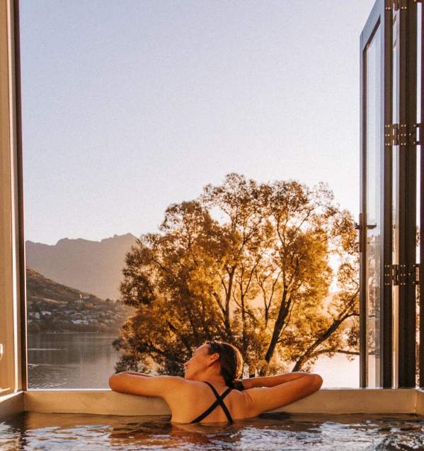 A lady enjoying the evening sunshine in a Driftaway Holiday Park Hot Tub
