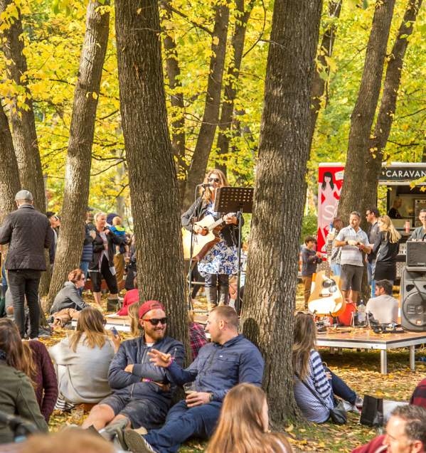 Festival goers enjoying live music at the Arrowtown Autumn Festival Pie, Pint and Pinot Event