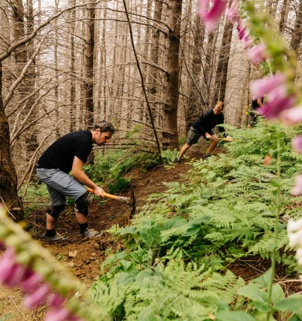 Volunteers helping build and maintain a mountain biking trail