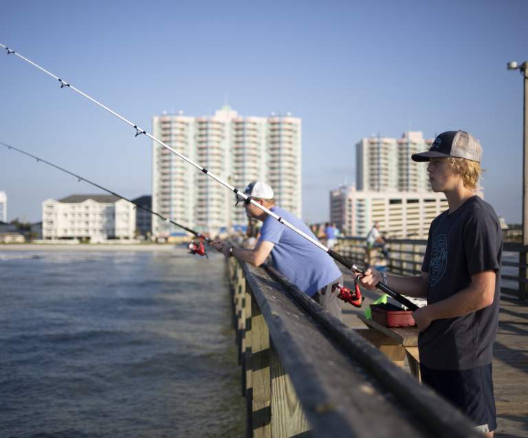 Fishermen cast a line over the side of the Cherry Grove Pier in North Myrtle Beach.