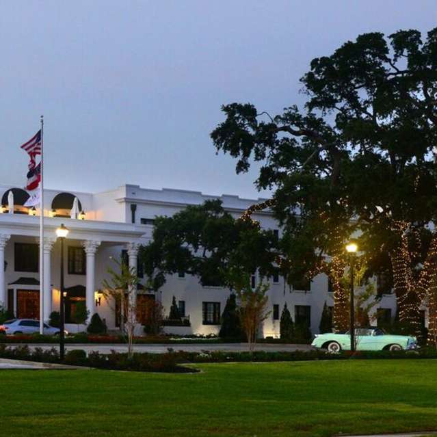 Exterior shot of the White House Hotel in Biloxi, MS at twilight