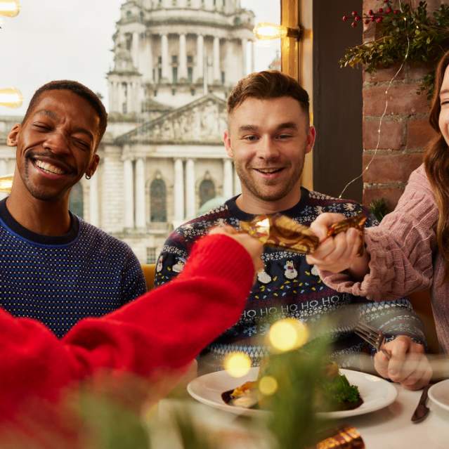 Group enjoying a Christmas dinner at Parisien