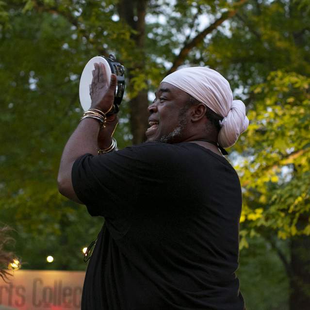 Guy Playing Tambourine at the Arts Market in Hillsborough