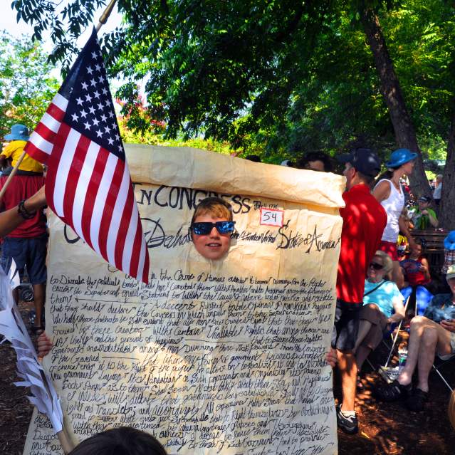 Person dressed up as the Declaration of Independence during July 4th in Carrboro