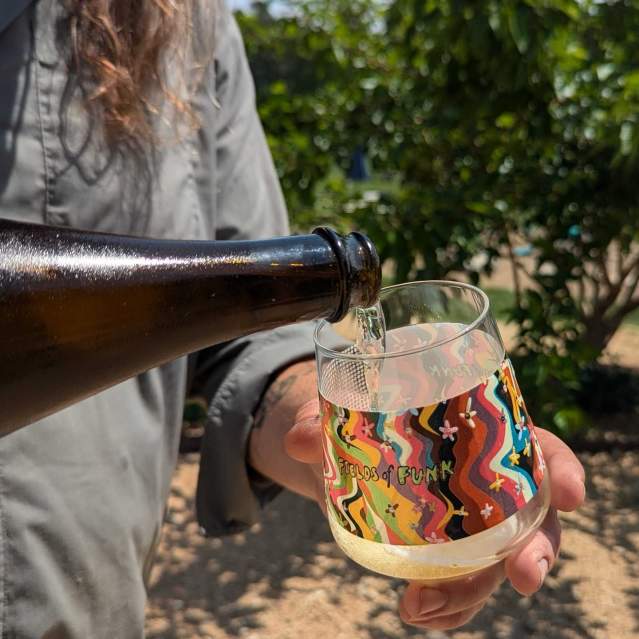 Beverage Pour into Fields of Funk Glass at the Fields of Funk Festival