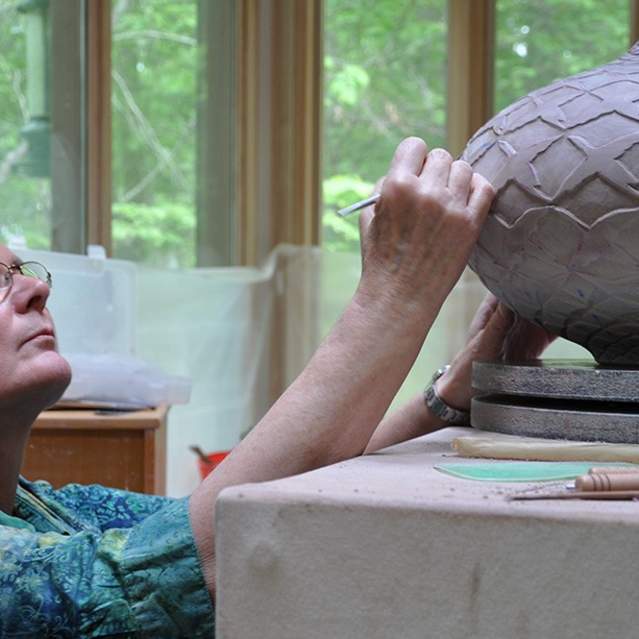 Ceramic Artist, Judith Ernst, working on a new piece