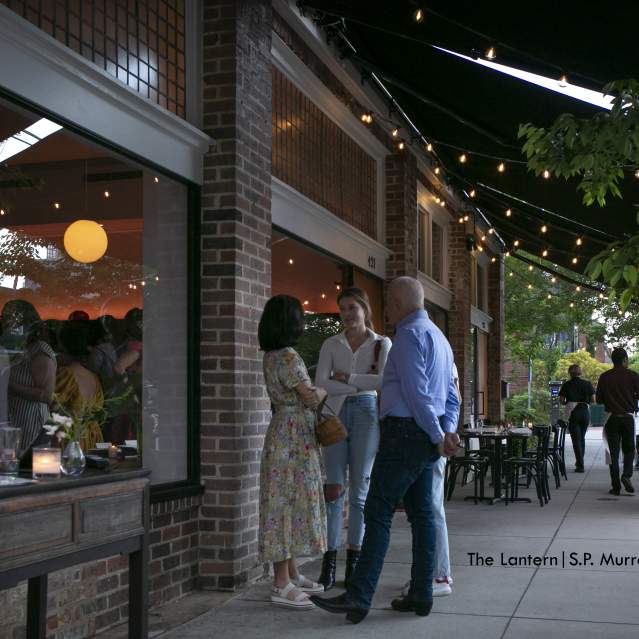 Group of People Talking Outside of Lantern Restaurant