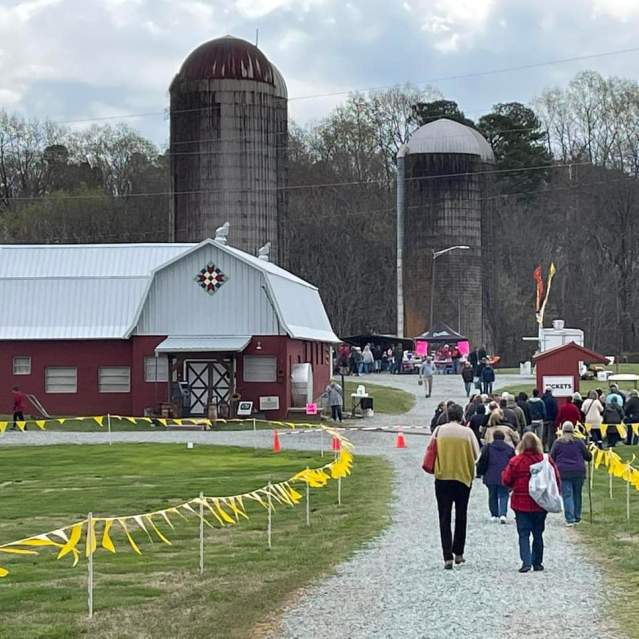 People Walking to the TarHeel Antiques Festival at Lloyd's Dairy