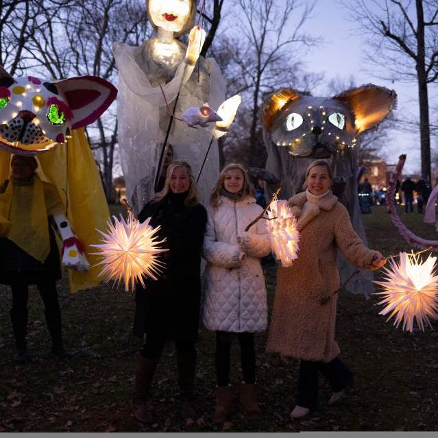 People with handmade lanterns participating in the Solstice Lantern Walk event in Hillsborough