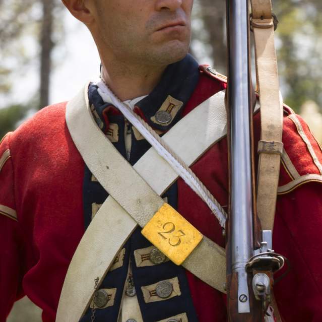 Person wearing a Revolutionary War Uniform during a reenactment event in Hillsborough