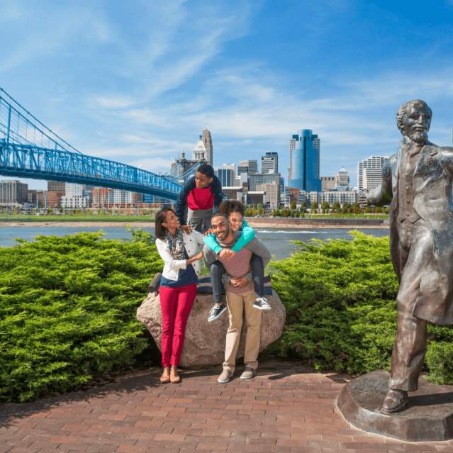 family posing on the Cincinnati waterfront