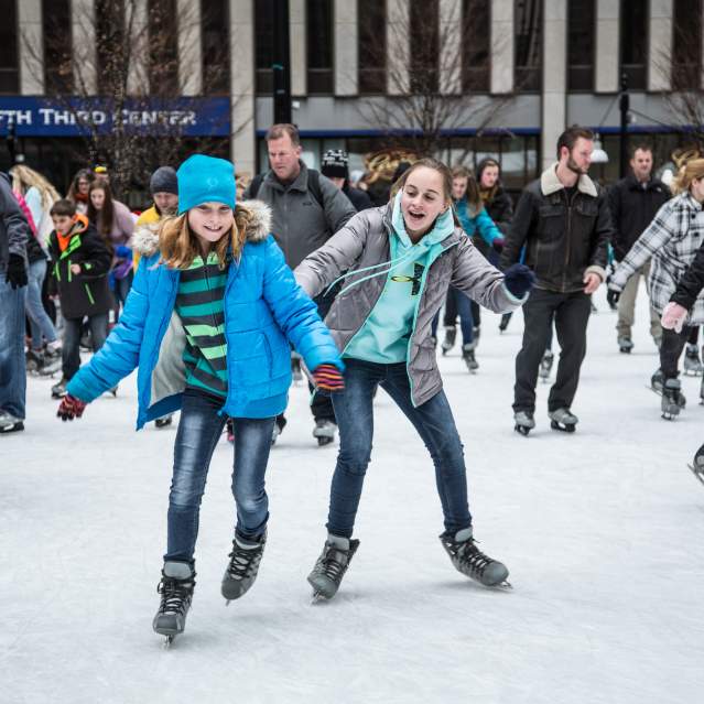 people enjoying ice skating in Cincinnati during the winter