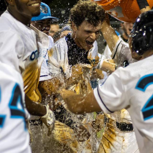 Players drenching another in Gatorade after a win