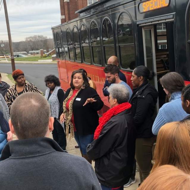 Woman giving historic tour to several visitors