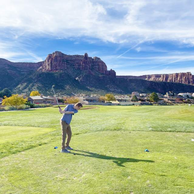 Person Swinging Golf Club at Tiara Rado in Fall