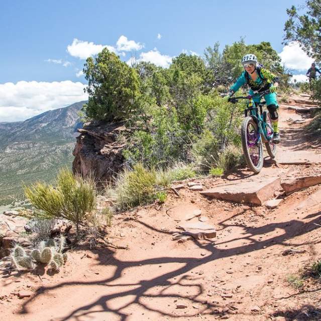Biker rides down the Palisade Plunge from the top of the Grand Mesa
