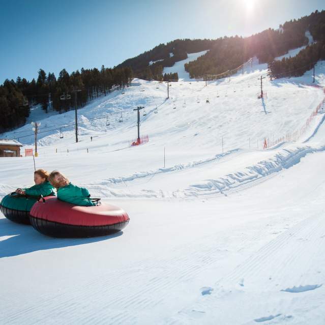 Snow King two kids tubing