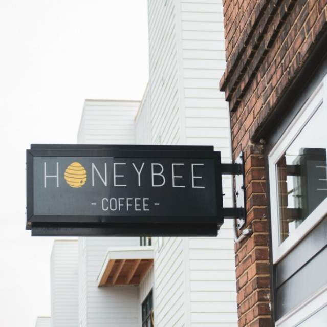The business sign for the Honeybee Coffee Co features their name and a little honey bee.
