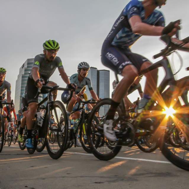 A group of road-cycling enthusiasts cruise the pavement at a Knoxville cycling event.