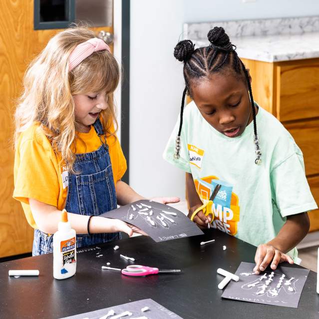 Two young children crafting at Muse Knoxville