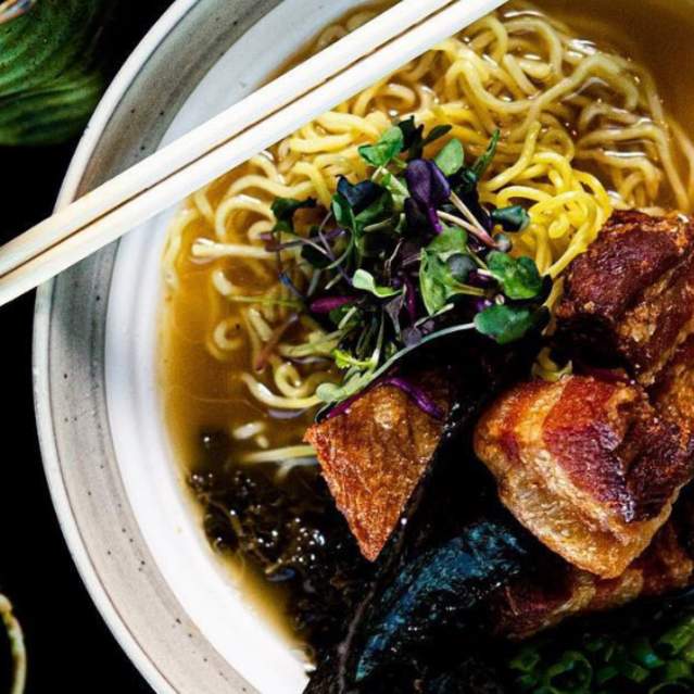A bowl of Tonkotsu ramen from Fin Two Japanese Ale House comes with crispy pork belly and braised kale.