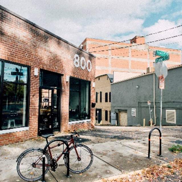 A bicycle rests outside the main entrance to Remedy Coffee in Knoxville, TN.