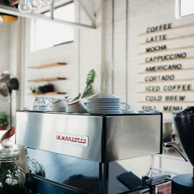 The stainless-steel exterior of the espresso machine at Remedy Coffee in Knoxville.