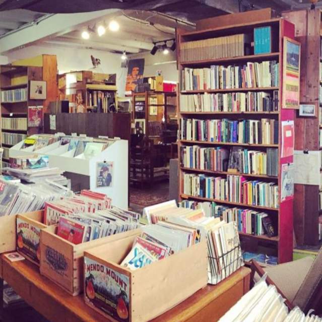 Interior of bookshop with bookshelves and cash register