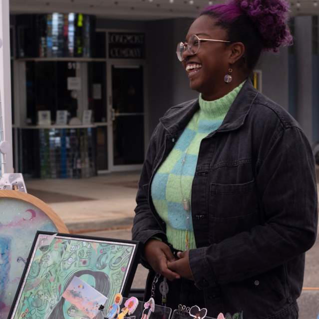 Art Walk table and artist