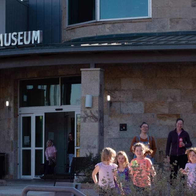 Children running outside Longmont Museum