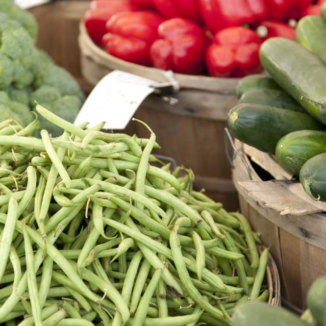 Farmer's Market baskets of beans, peppers, broccoli and cucumbers