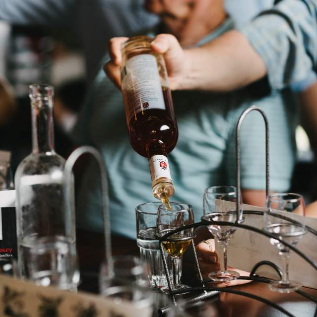 bartenders pouring drinks