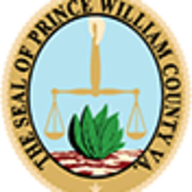 Official Prince William County Virginia Seal with a hand, holding scales of judgement, and a tobacco leaf.