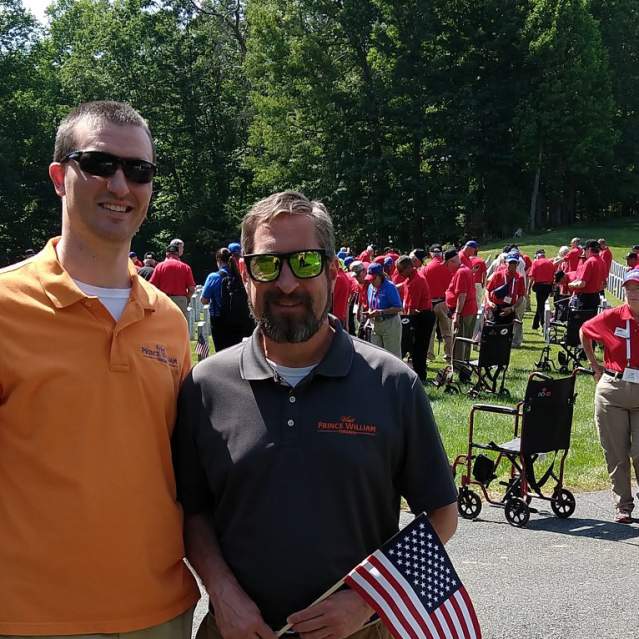 Sales team with tour group at Quantico Cemetery