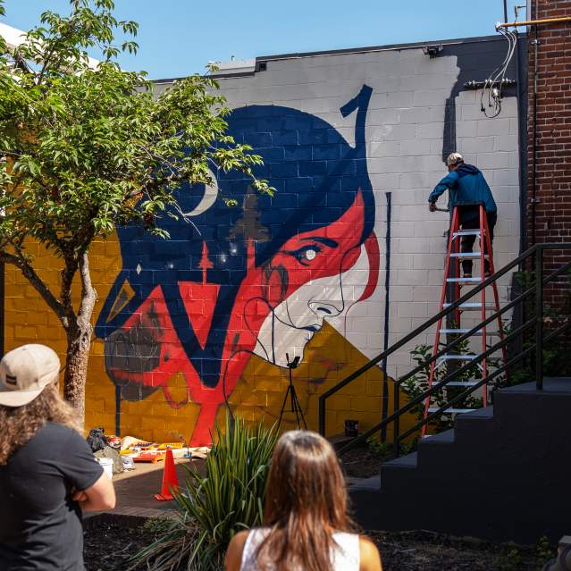 Wine Destination mural being painted.