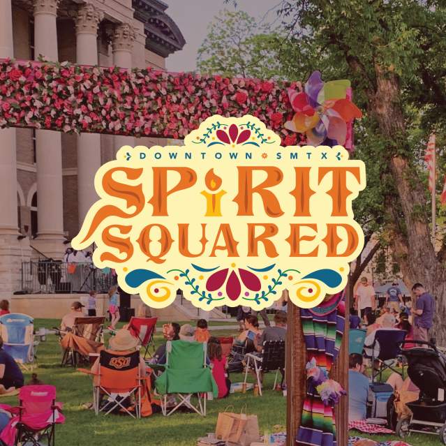 dimmed photo of event in front of the court house with the "spirit squared" logo in front