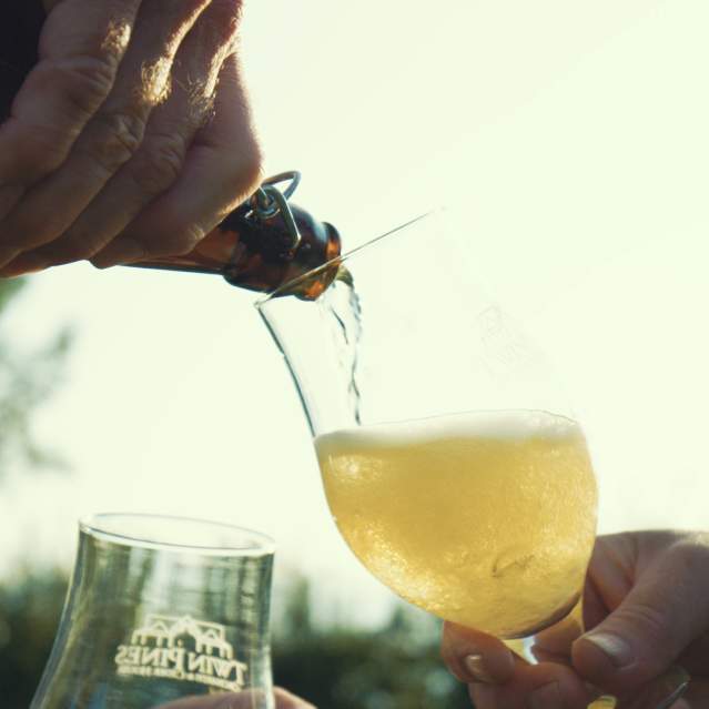 Cider pouring into glass